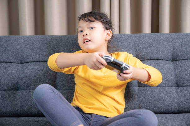 Girl enjoy with video game at home